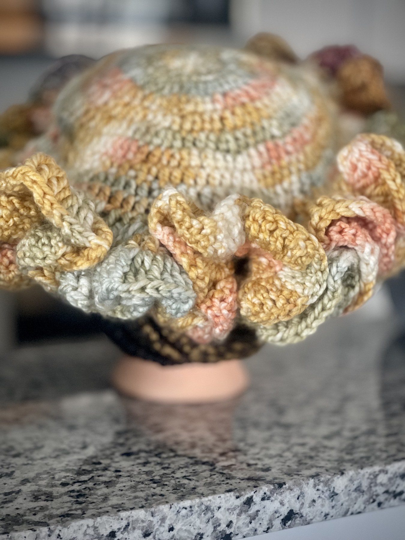 Back view showing the hat's colorful crochet pattern