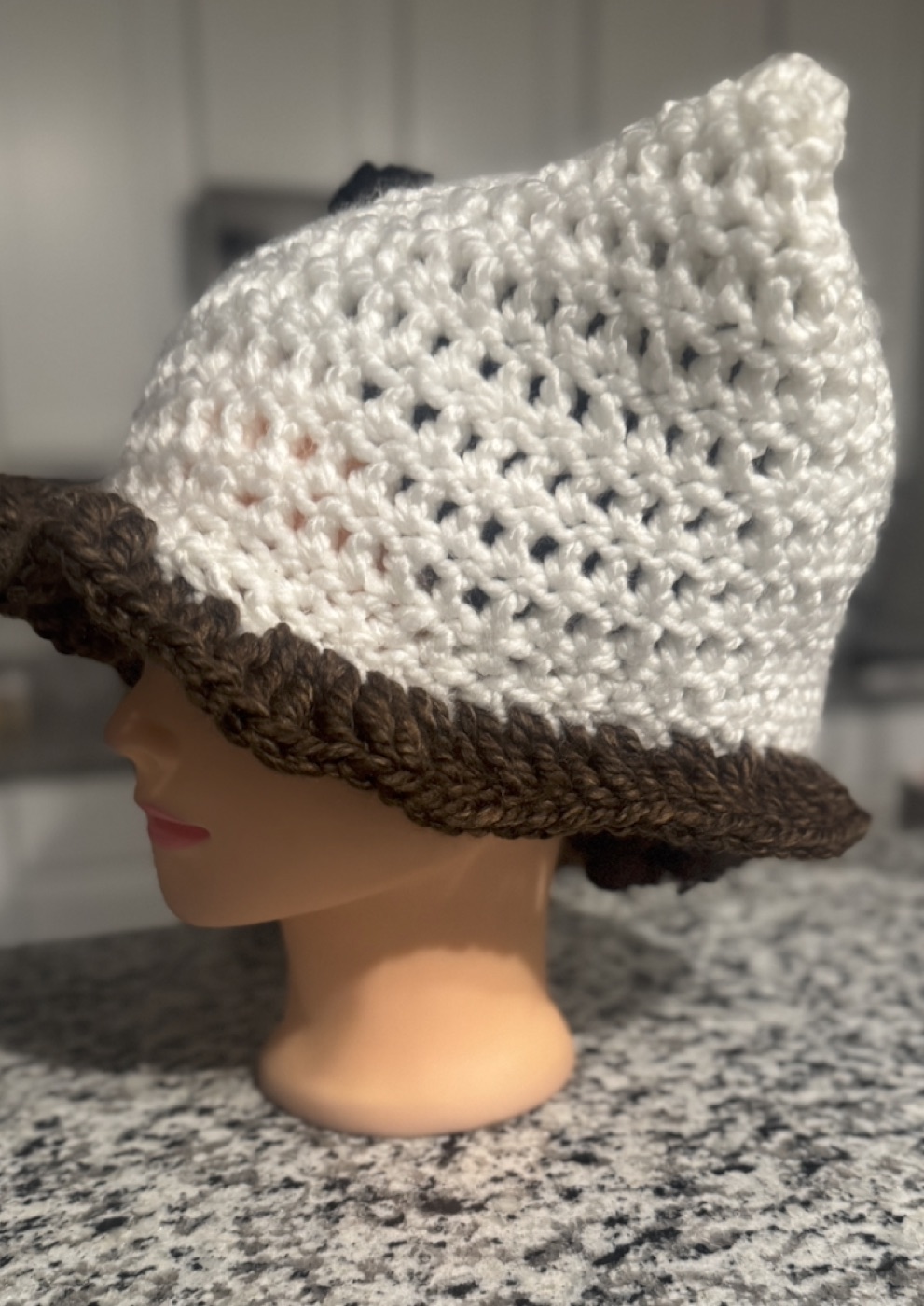 Opposite side view of the puppy-inspired ruffle hat